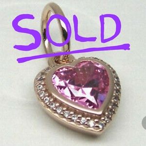 Pandora rose gold heart dangle charm.